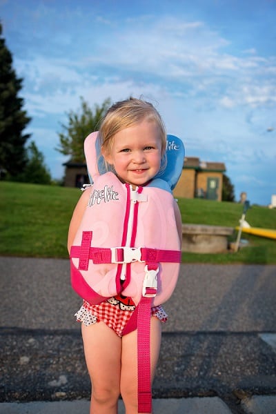 child wearing a life jacket